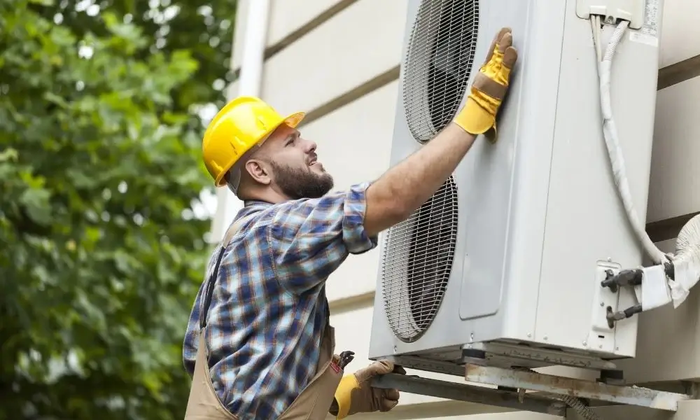 Crew installing a high‑efficiency gas furnace with sealed venting, proper condensate trap and clean workspace in Ypsilanti. Call (734) 999-7310. Call (734) 999-7310 for Ypsilanti, MI.
