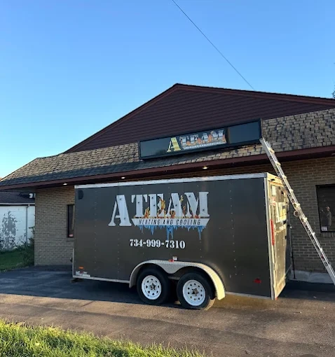 hvac technician repairing ac unit ann arbor mi a team heating cooling call 734-999-7310